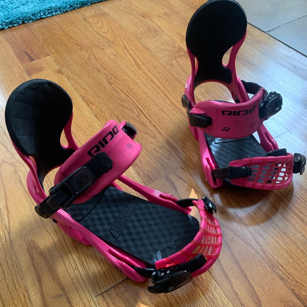 Hot pink Ride brand women’s snowboard bindings